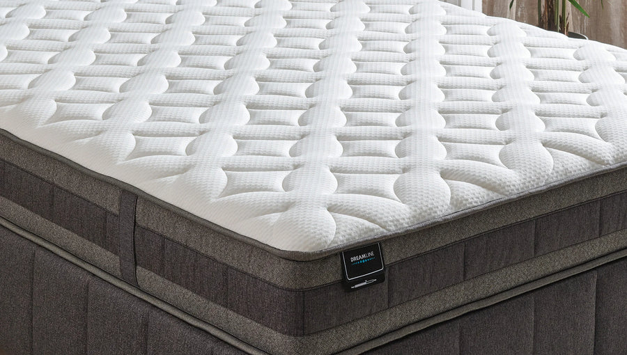 Dream Line matras van dichtbij, met zicht op de gewatteerde toplaag en de baza