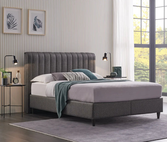 Blue Star baza boxspring opgemaakt met roze en petrol beddengoed