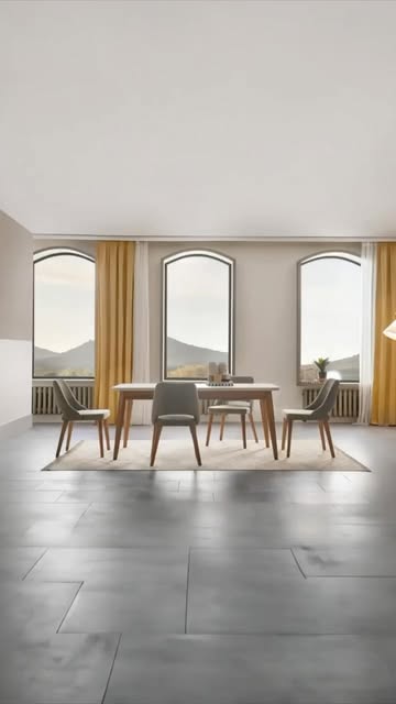 Eettafel met stoelen in een lichte ruimte met boogramen